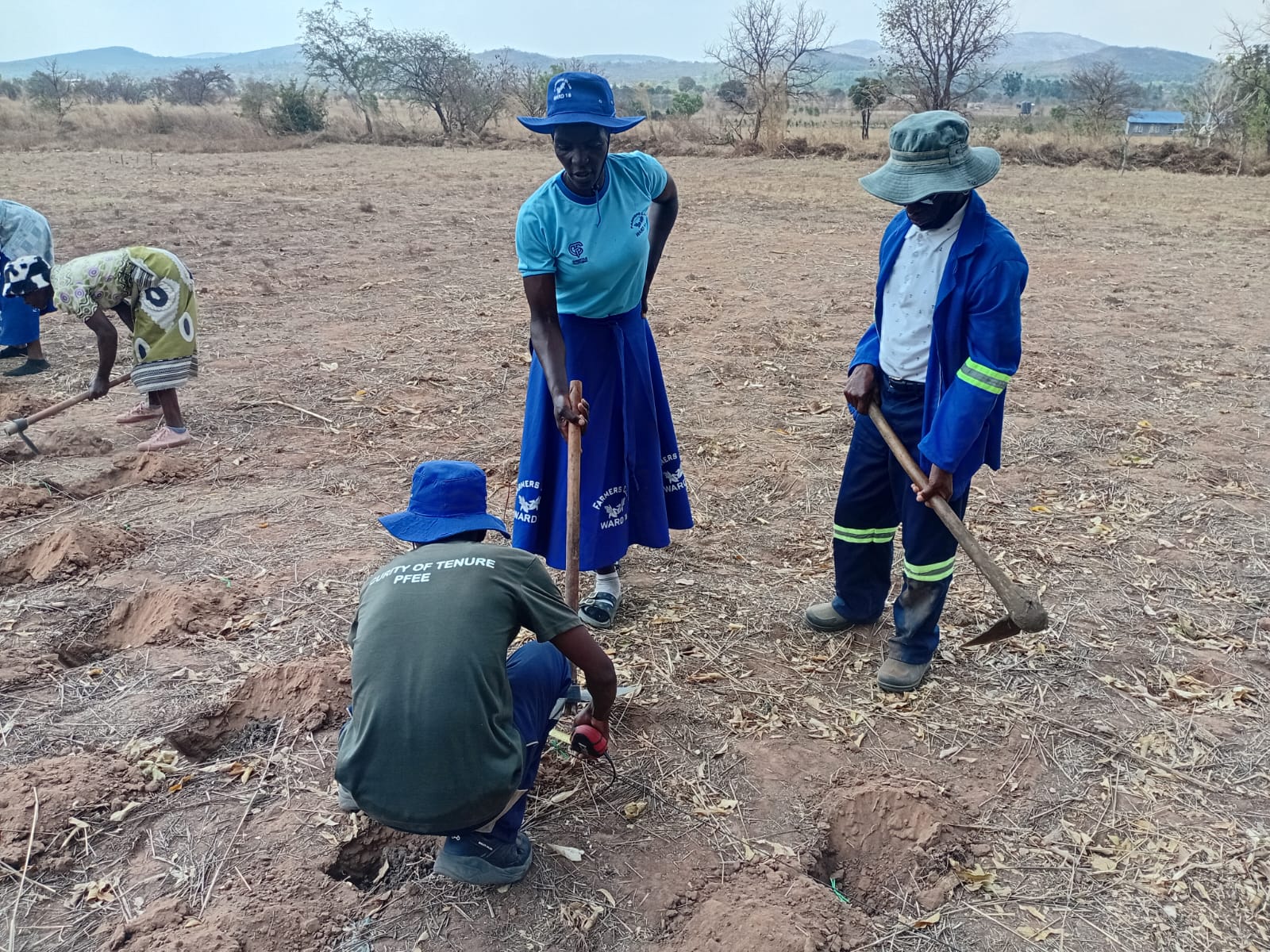 Farmers demonstrating land preparation