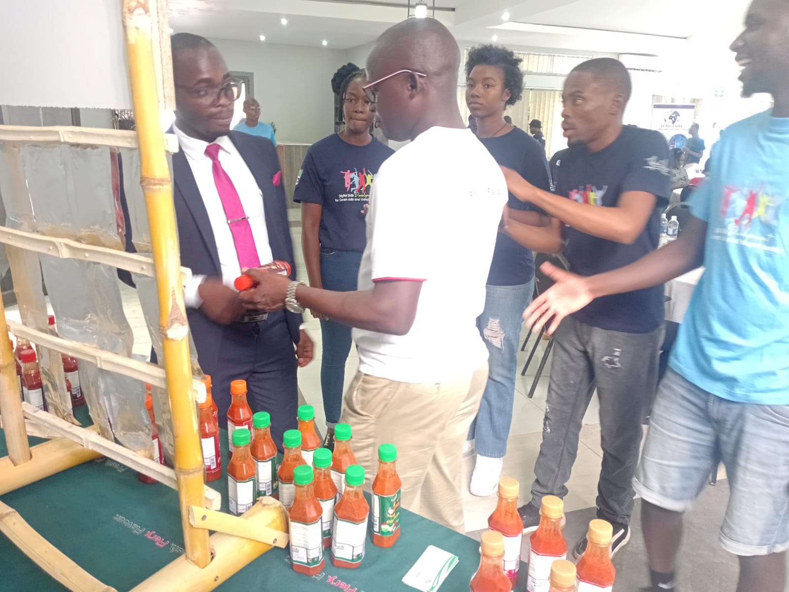 Presenting KaBlaze sauces to guests at exhibition